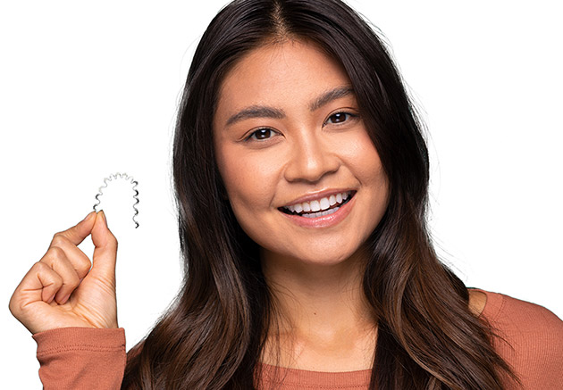 woman with inbrace orthodontic treatment